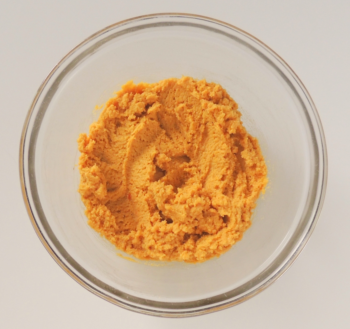 A bowl of pumpkin cookie dough