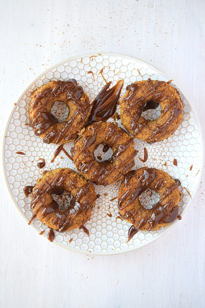 A plate full of freshly made gluten free paleo pumpkin donuts