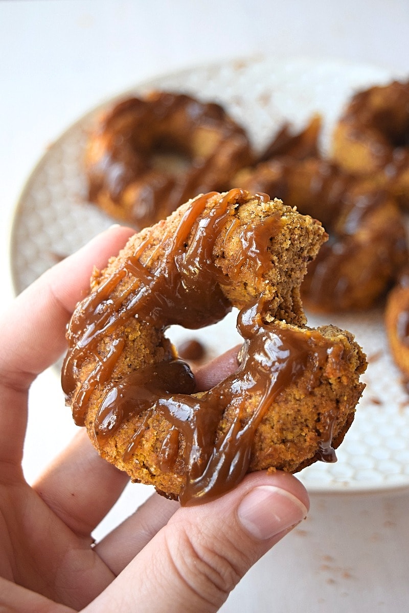 A gluten free paleo pumpkin donut with a bite taken out of