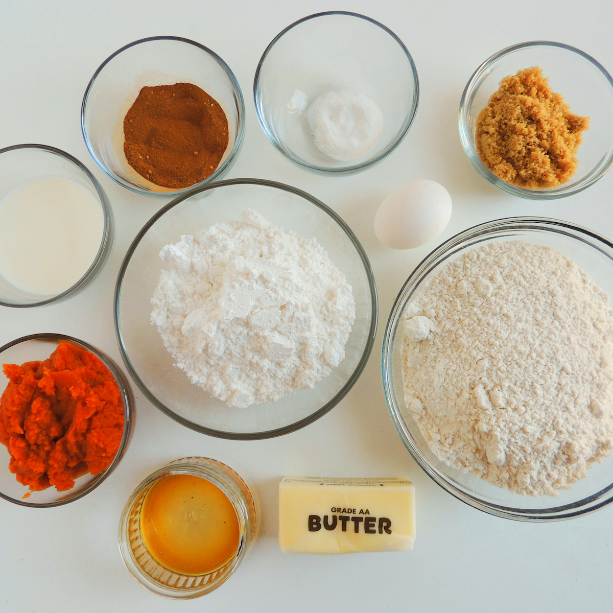 Ingredients for pumpkin scones all laid out on a table.