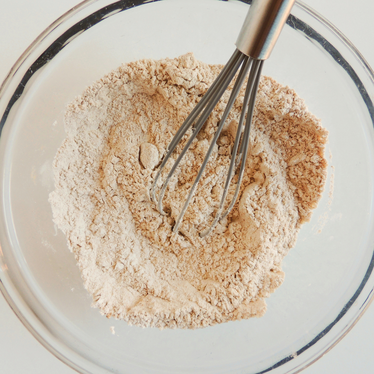 Mixing flour to make gluten free pumpkin scones.