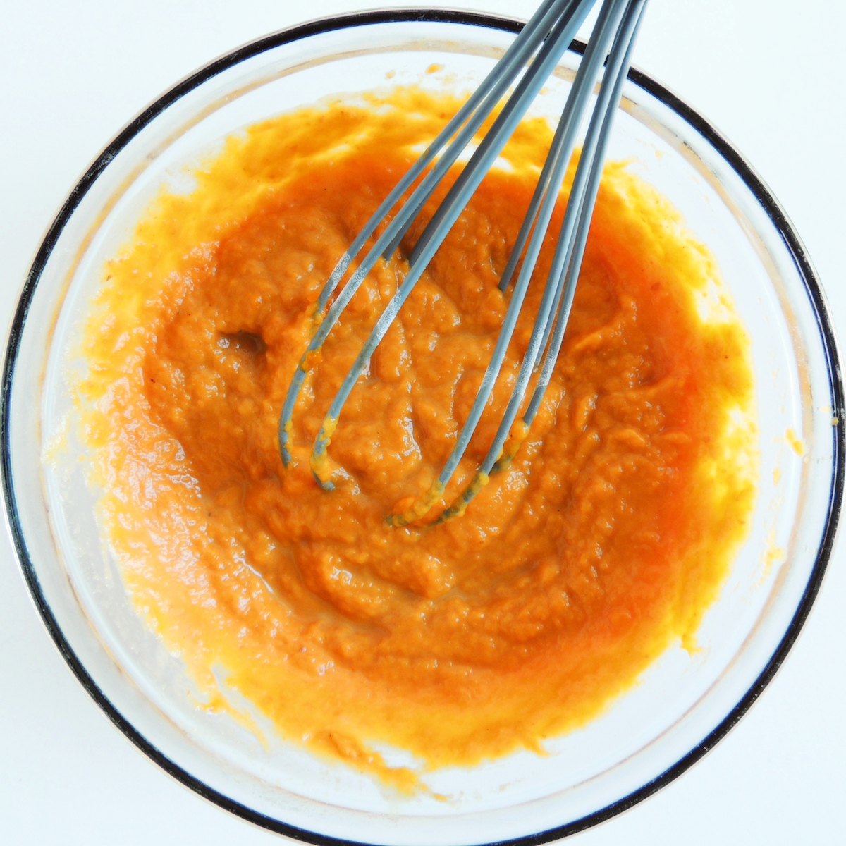 Mixing together the pumpkin puree for gluten free pumpkin scones.