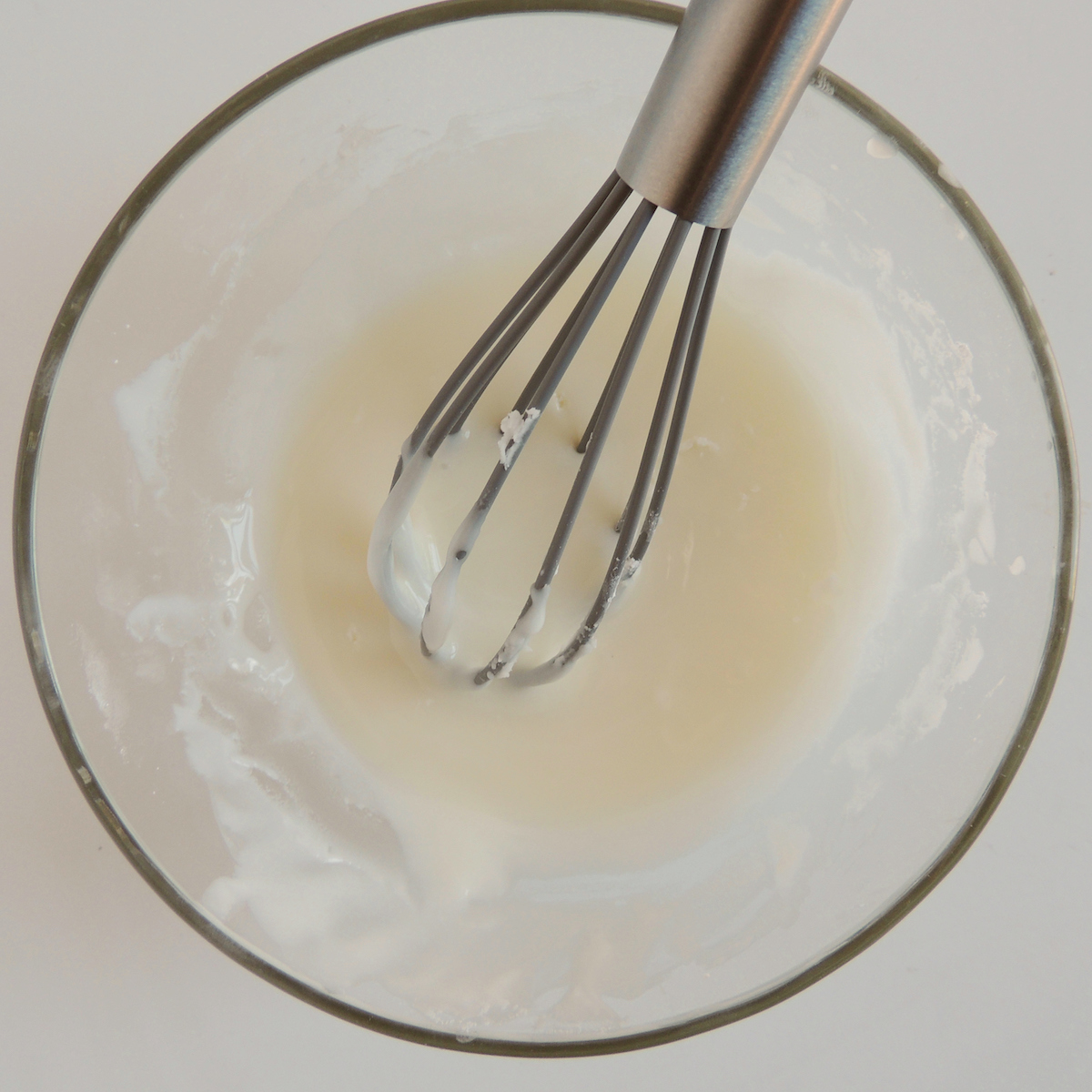 Whisking ingredients for gluten free pumpkin scones.