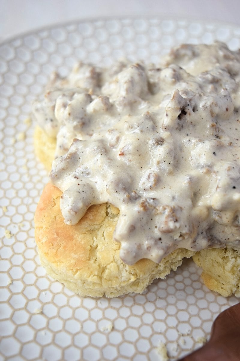 Cover image for Gluten Free Biscuits and Gravy. Features gluten free buttermilk biscuits with gravy on them.