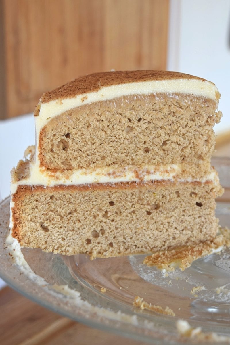Piece of gluten free spice cake with cream cheese frosting