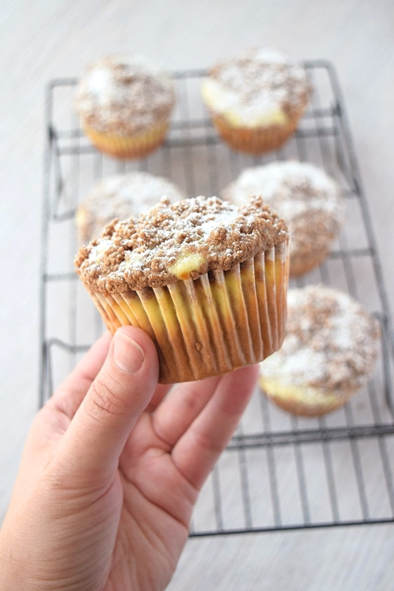 Holding up a gluten free coffee cake above the rest