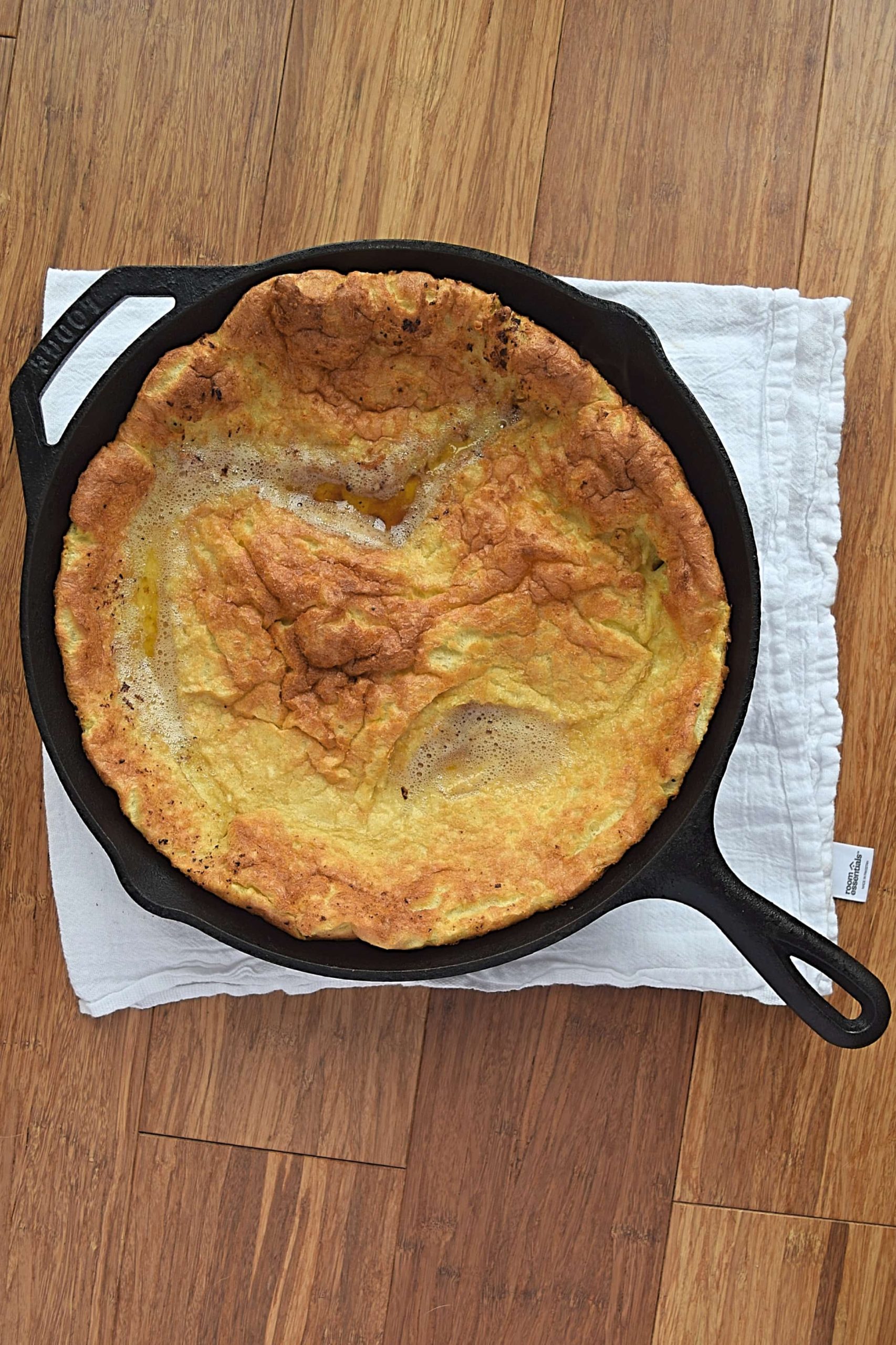 An above view of a dutch baby in a cast iron pan.