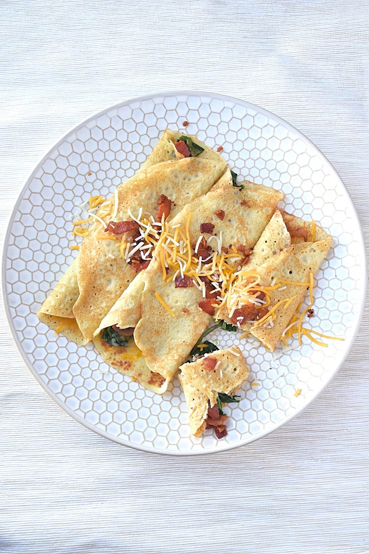 Cover image for savory crepes blog post. Features 3 crepes on a white crepe.