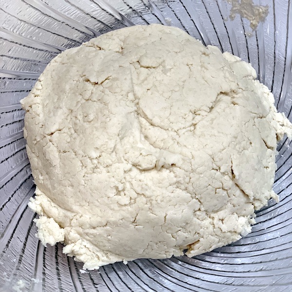 scone dough after the incorporation of milk in a silver bowl