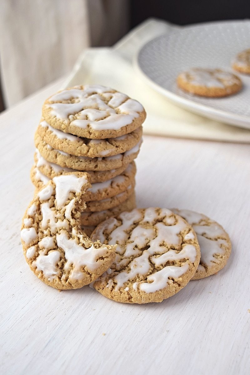 A stack of old fashioned oatmeal cookies displayed on a plate.