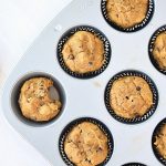 Top-down view of gluten free pumpkin chocolate chip muffins in a tin.
