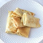 Image of a plate filled with gluten free crepes.