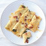 Cover image for savory crepes blog post. Features 3 crepes on a white crepe.
