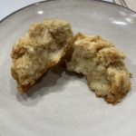 gluten free scone split in half and displayed on an earthenware plate