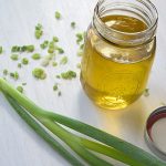 Scallion oil with ingredients beside it