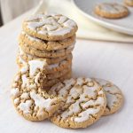 A stack of old fashioned oatmeal cookies displayed on a plate.